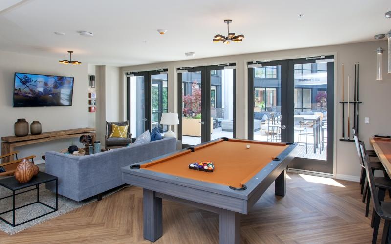 a living room with a pool table