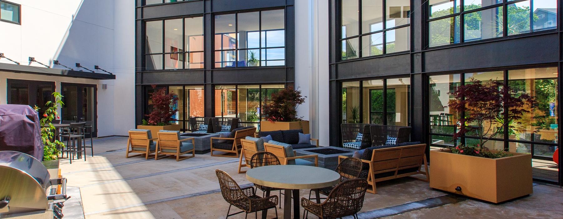 a building with tables and chairs outside