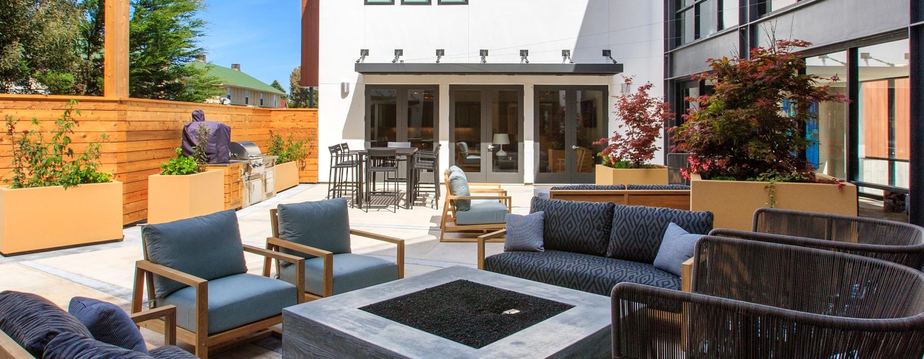 a patio with chairs and tables